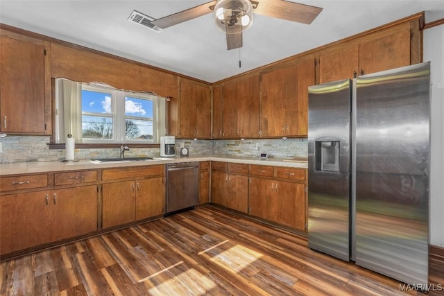 kitchen featuring a sink, visible vents, brown cabinets, and appliances with stainless steel finishes