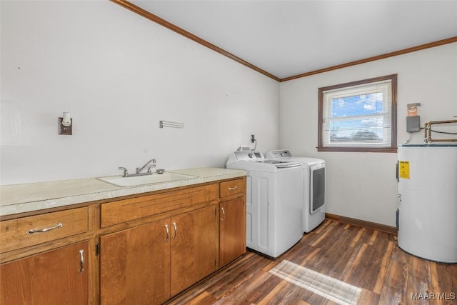 laundry room featuring dark wood finished floors, water heater, ornamental molding, a sink, and washing machine and dryer