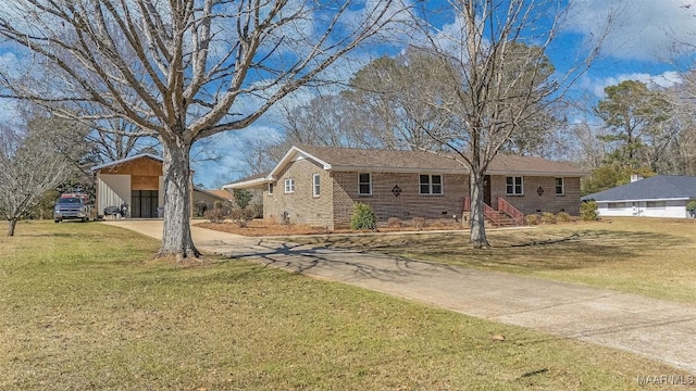 ranch-style home featuring a front yard, driveway, a carport, crawl space, and brick siding