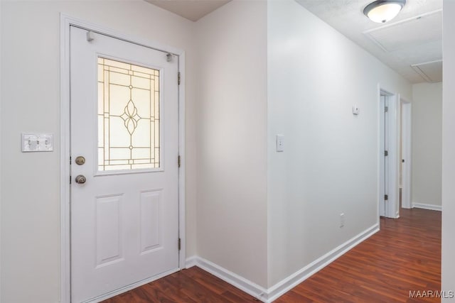 foyer entrance with baseboards and dark wood-style flooring