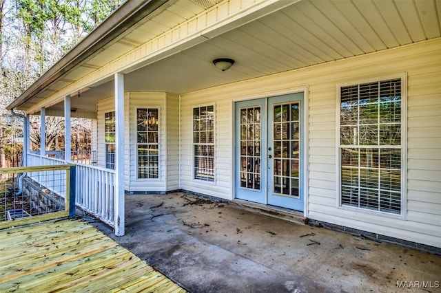 deck with a porch and french doors