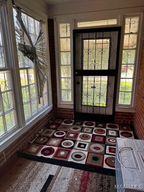 doorway with brick wall