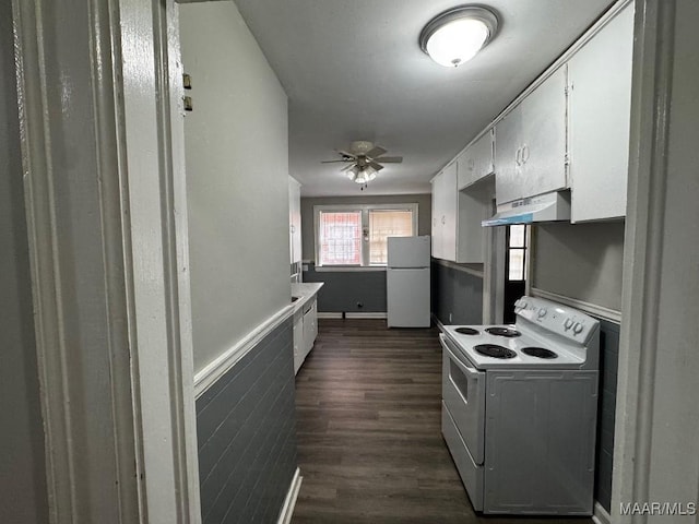 kitchen featuring dark wood-style flooring, white cabinets, white appliances, a ceiling fan, and under cabinet range hood