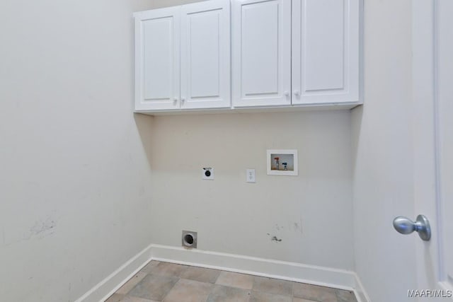 washroom featuring electric dryer hookup, baseboards, cabinet space, and hookup for a washing machine