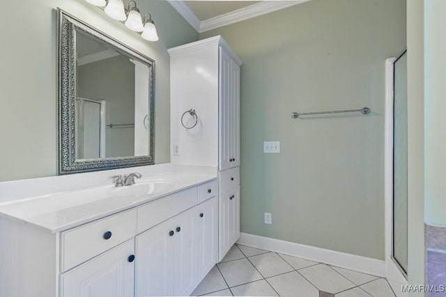 bathroom with vanity, baseboards, a shower with shower door, ornamental molding, and tile patterned flooring