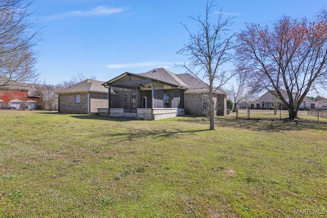 view of front of property with a front lawn and a sunroom