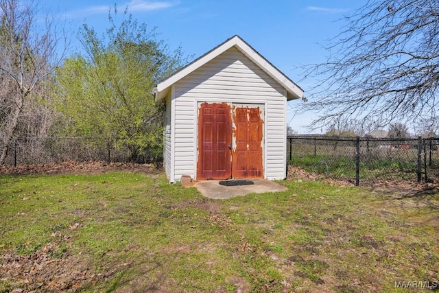 view of shed featuring fence