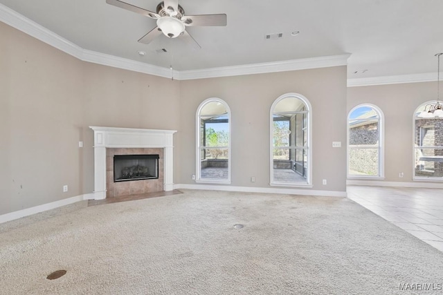 unfurnished living room with visible vents, ornamental molding, carpet, baseboards, and ceiling fan