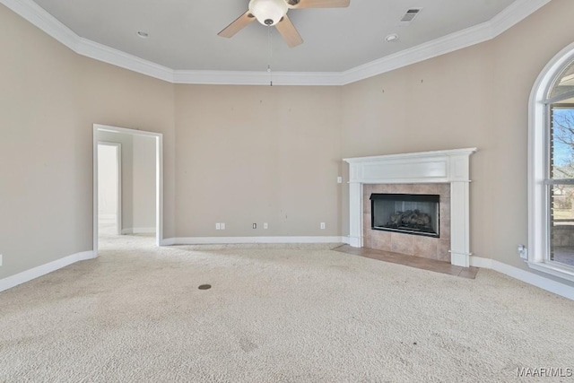 unfurnished living room featuring visible vents, carpet flooring, a fireplace, crown molding, and baseboards