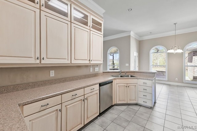 kitchen with dishwasher, ornamental molding, cream cabinetry, and a sink