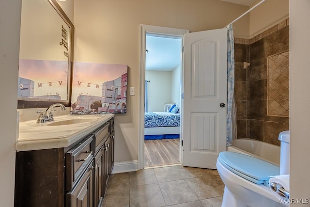 bathroom featuring connected bathroom, toilet, shower / bath combo with shower curtain, tile patterned floors, and vanity