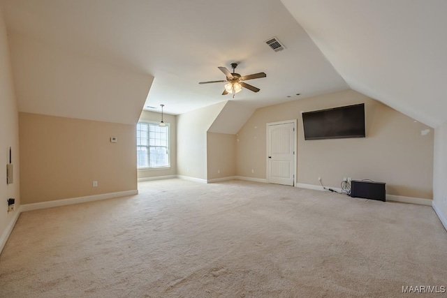 bonus room with visible vents, baseboards, ceiling fan, vaulted ceiling, and carpet flooring