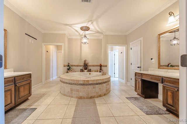 bathroom featuring vanity, visible vents, ornamental molding, tile patterned flooring, and a garden tub