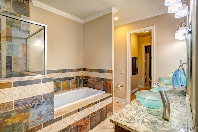 bathroom with a garden tub, a stall shower, and ornamental molding