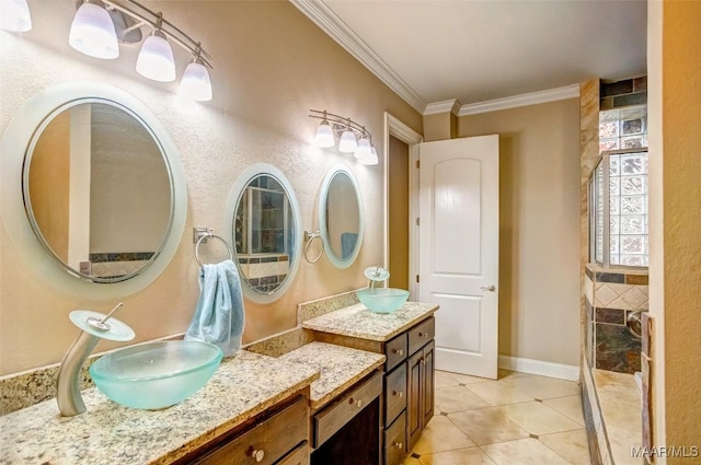 bathroom featuring tile patterned floors, baseboards, ornamental molding, and vanity