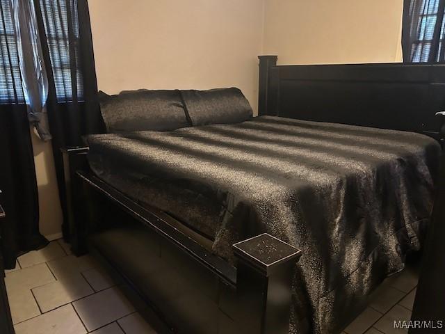 2146 Powell Ln, Montgomery, AL 36110 - bedroom featuring light tile patterned floors