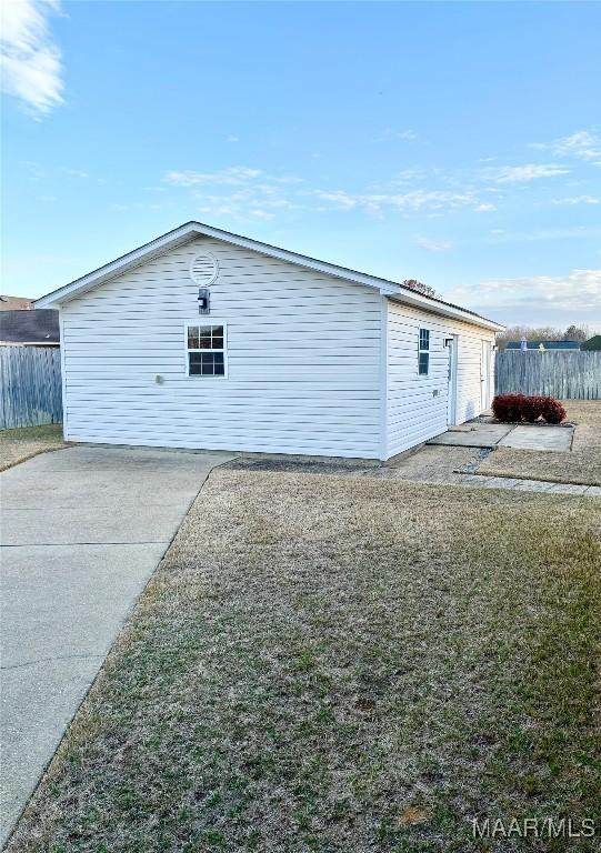 exterior space with a yard and fence