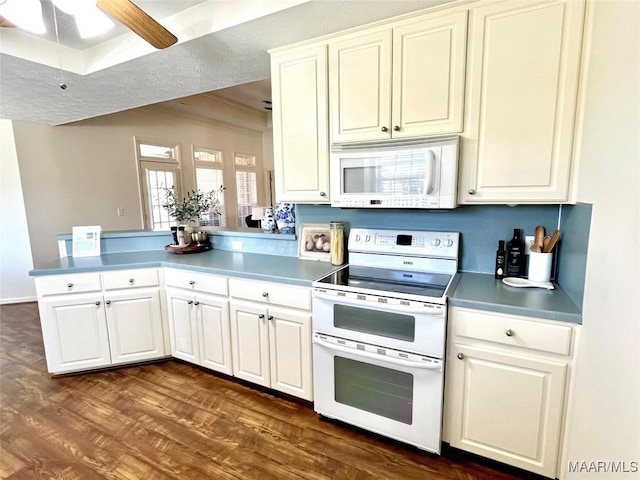kitchen with white appliances, a peninsula, dark wood-style flooring, a ceiling fan, and crown molding