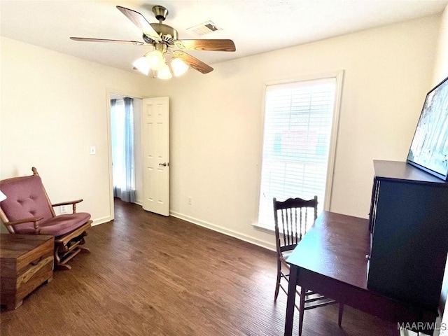 home office featuring dark wood-style flooring, ceiling fan, and baseboards