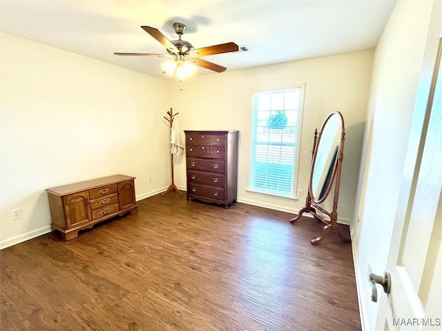 bedroom featuring dark wood finished floors, baseboards, and ceiling fan