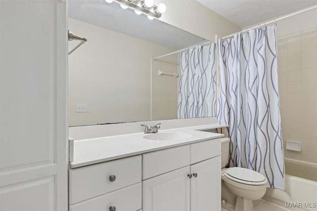 bathroom featuring toilet, shower / tub combo with curtain, vanity, and tile patterned flooring