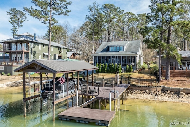 view of dock with boat lift and a water view