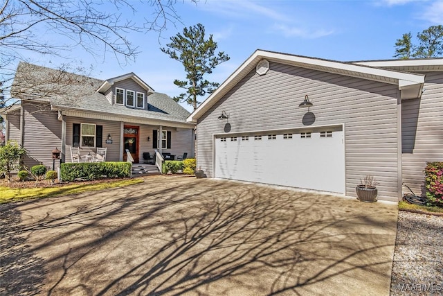 view of front of house with a porch and concrete driveway