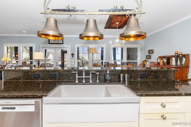 kitchen featuring stainless steel dishwasher, crown molding, dark stone countertops, and french doors