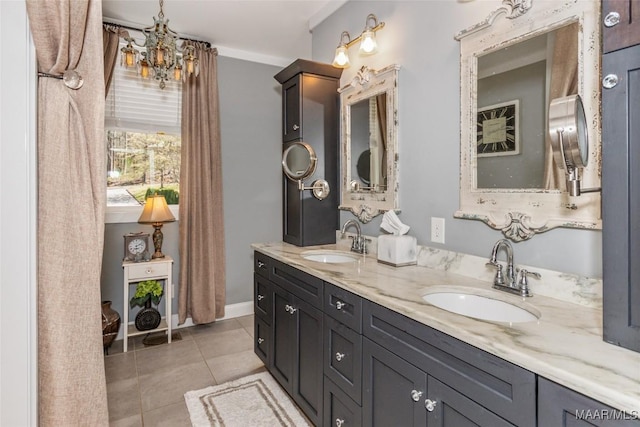 full bathroom featuring a sink, a notable chandelier, double vanity, and tile patterned floors