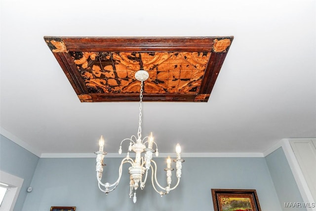 room details featuring a notable chandelier and ornamental molding