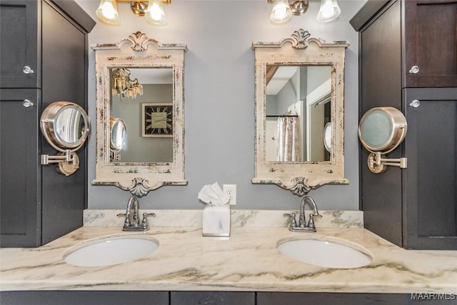 bathroom featuring a sink and double vanity