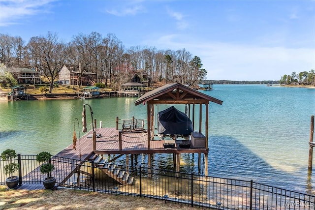 dock area featuring a water view and boat lift