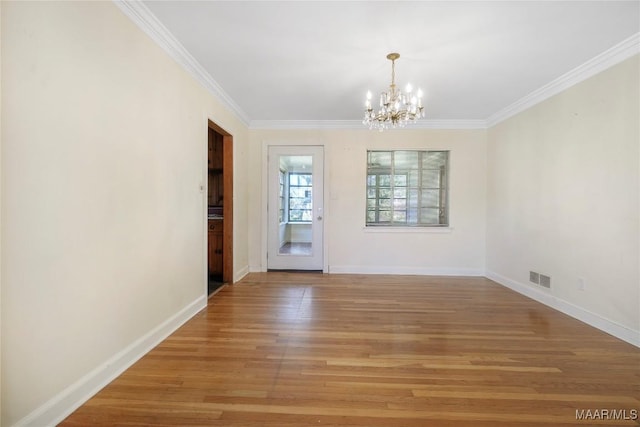 unfurnished dining area with visible vents, light wood-style flooring, baseboards, and an inviting chandelier