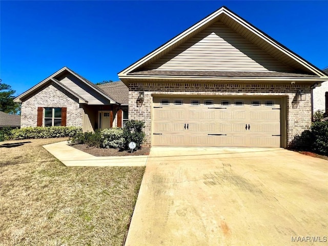 view of front facade featuring a garage, brick siding, and driveway