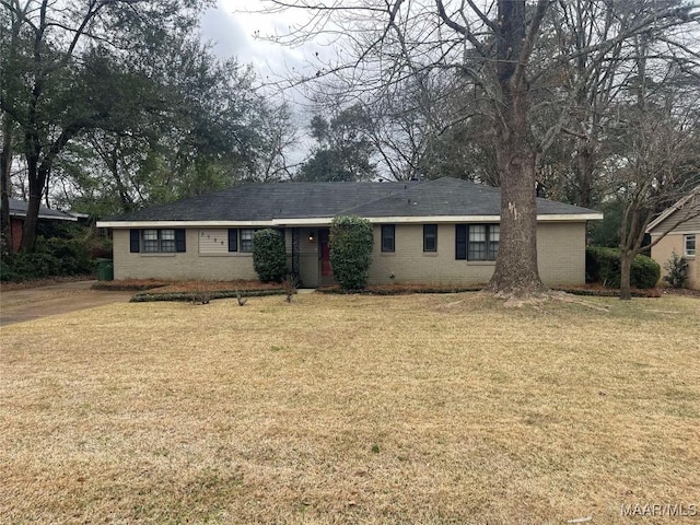 ranch-style house with a front lawn and brick siding