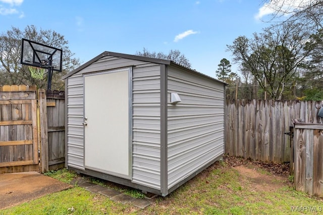 view of shed with fence