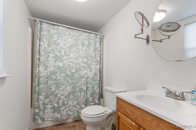 full bathroom featuring tile patterned floors, toilet, and vanity