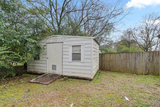 view of shed with a fenced backyard