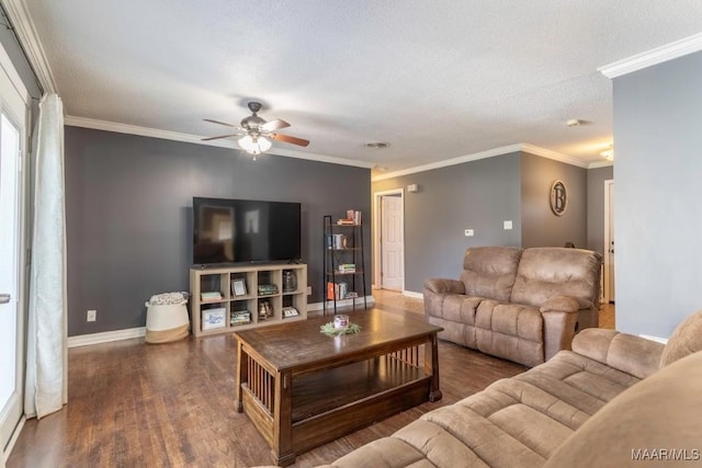 living room featuring crown molding, ceiling fan, baseboards, wood finished floors, and a textured ceiling