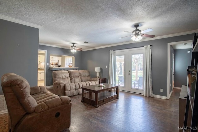 living area featuring dark wood finished floors, french doors, crown molding, baseboards, and ceiling fan