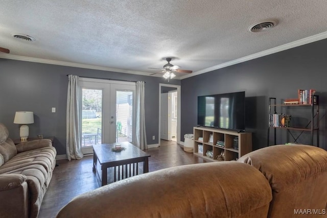 living room featuring french doors, visible vents, and ornamental molding