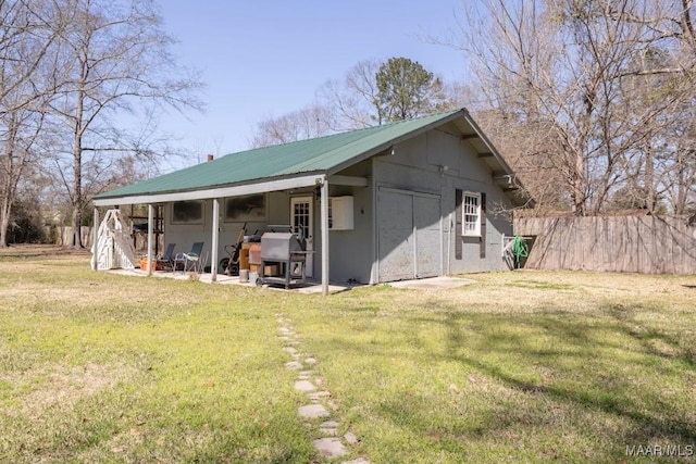 view of outbuilding with fence