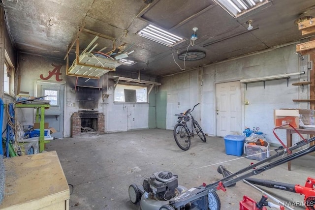 garage with a brick fireplace