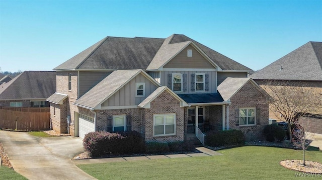 craftsman-style house with fence, brick siding, concrete driveway, a front lawn, and board and batten siding