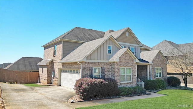 craftsman-style house with brick siding, board and batten siding, a front lawn, fence, and concrete driveway