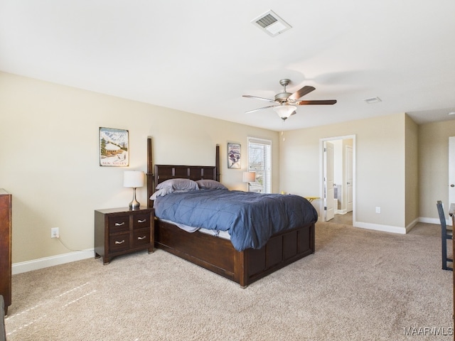 bedroom with ceiling fan, light colored carpet, visible vents, and baseboards