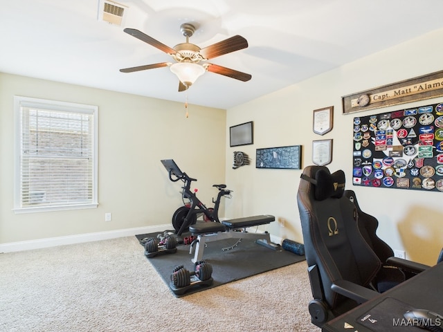 workout room with visible vents, baseboards, a ceiling fan, and carpet flooring