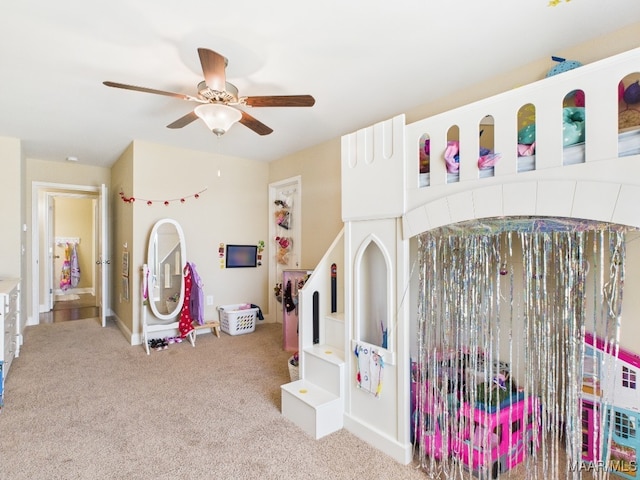 game room featuring carpet floors and a ceiling fan