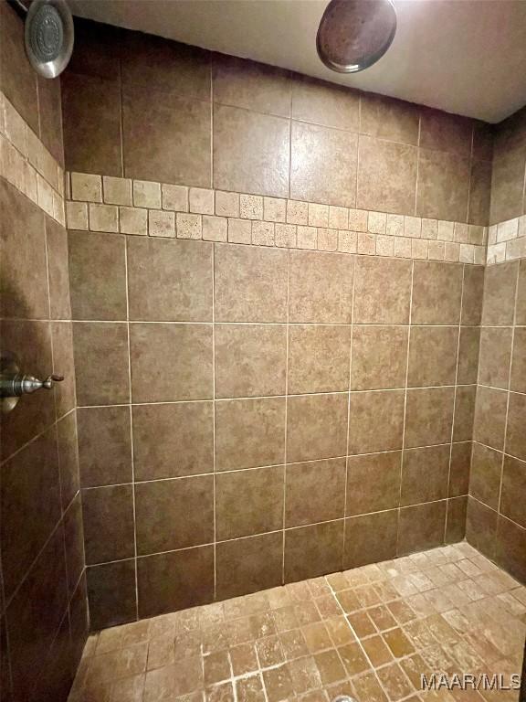 bathroom with tiled shower