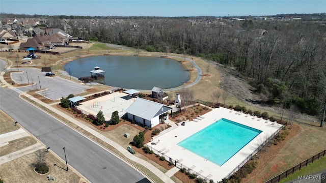 bird's eye view featuring a water view and a wooded view